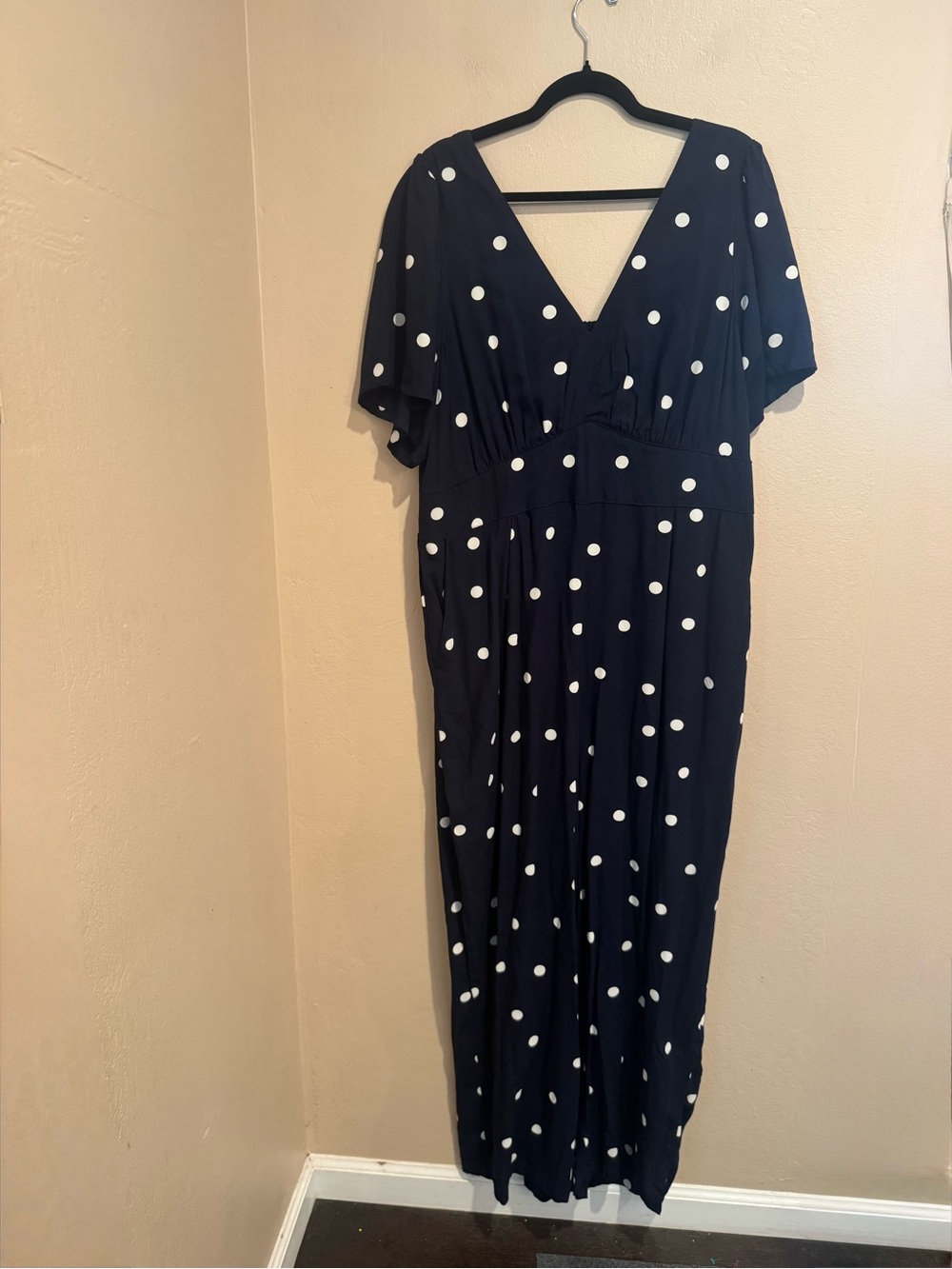 Navy Romper with White Polka Dots, Short Sleeves, Smocked Back and side Pockets
